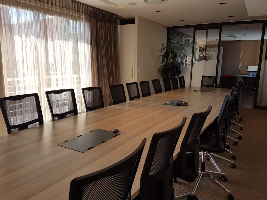 The Avior Capital Markets boardroom seen from the window end, table and chairs by Nuwave