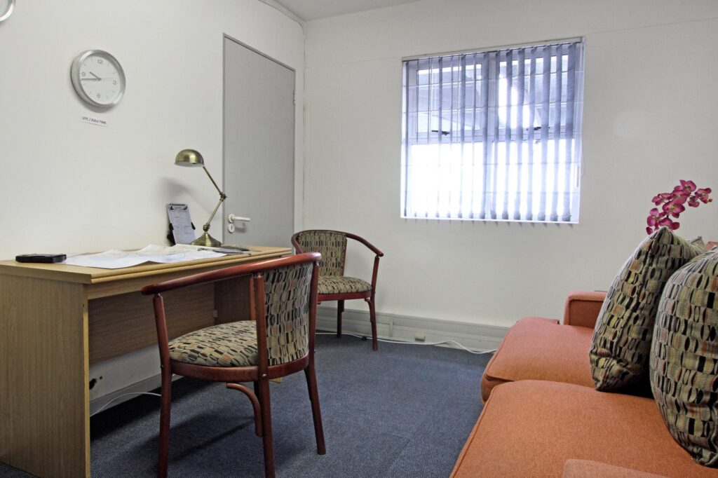 An office desk with chairs and a couch at Signature Flight Support, Cape Town Airport, furnished by Nuwave