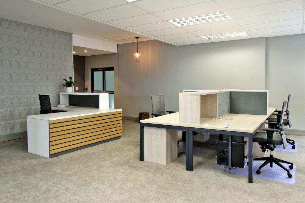 A workstation cluster beside the reception counter at New Approach Medical, supplied by Nuwave