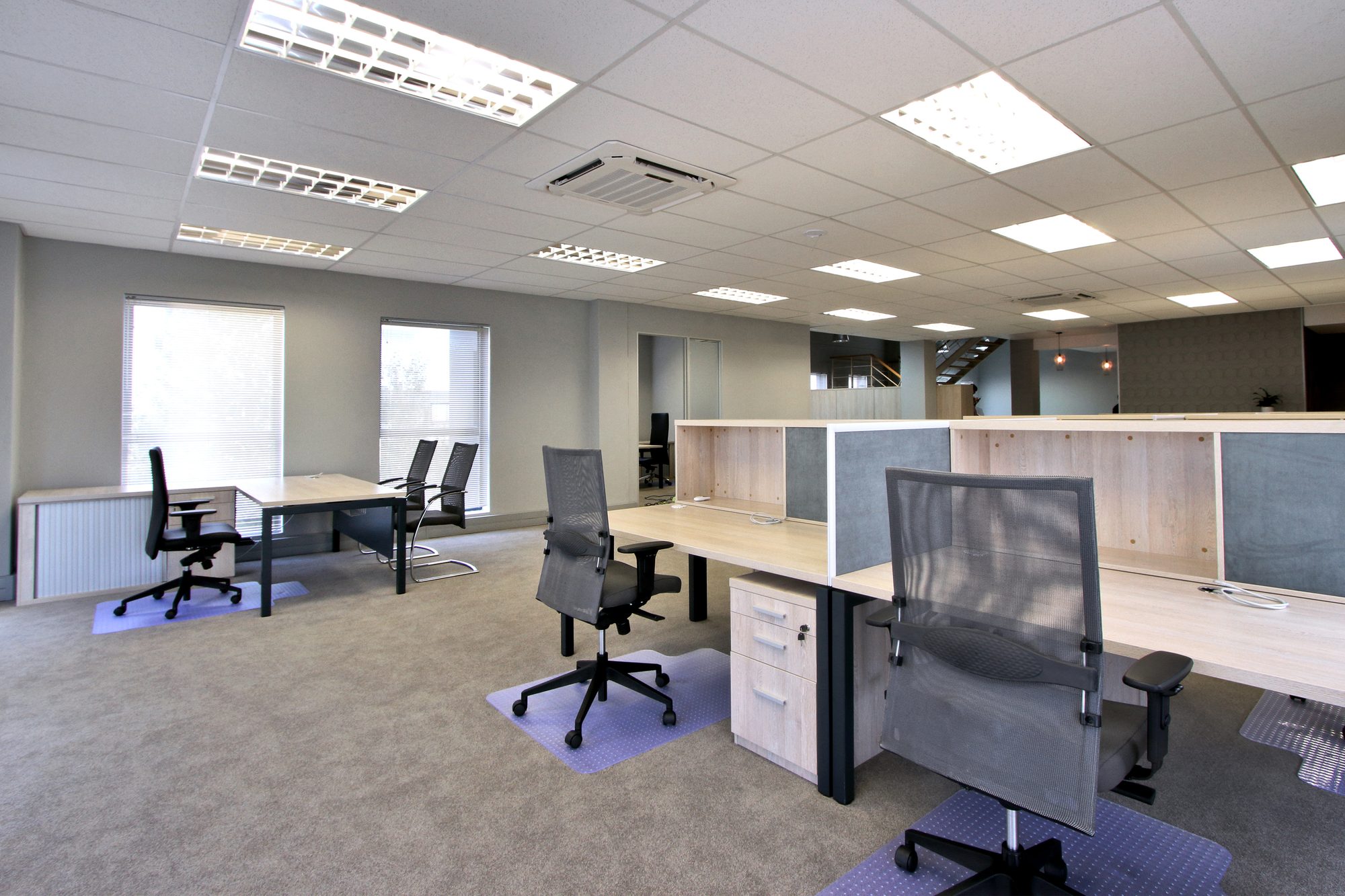 Desk clusters with mesh back task chairs at New Approach Medical in Cape Town, by Nuwave