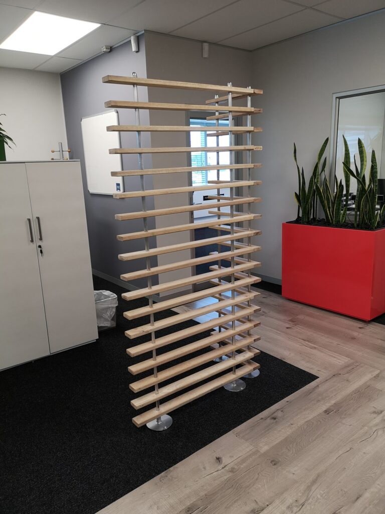 Timber slat screens with planters across the Nordex Energy floor in Cape Town, by Nuwave
