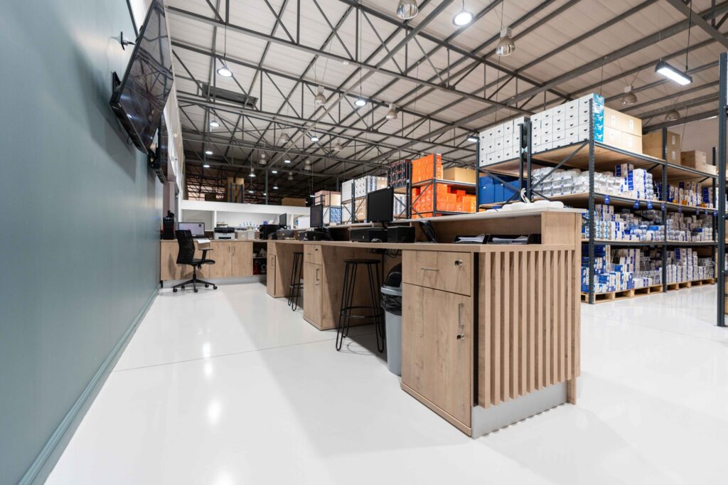 Sales desks with timber fronts on the showroom floor at Crystal Direct, by Nuwave