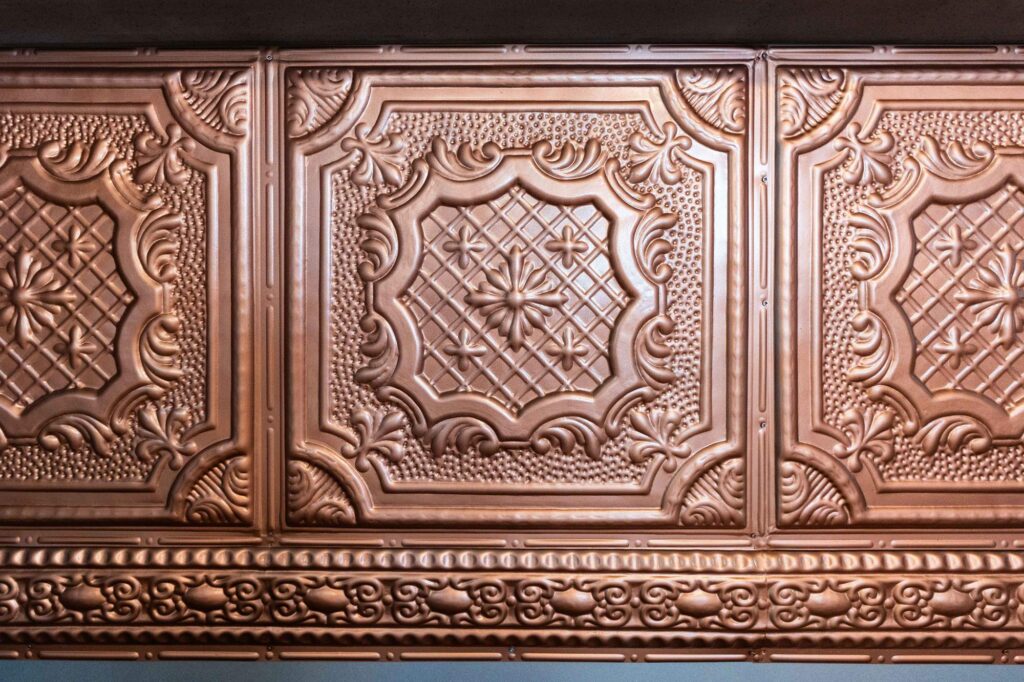 The pressed metal counter front in copper at the Crystal Direct cafe, fitted by Nuwave