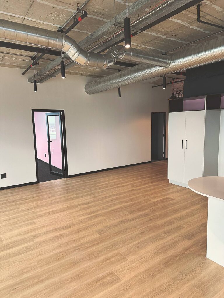 Timber flooring and the curved counter end at Polycat Visual Effects, by Nuwave
