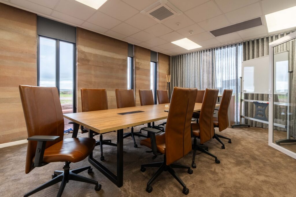 The boardroom table with tan leather chairs at Oil Spill Response in Cape Town, supplied by Nuwave