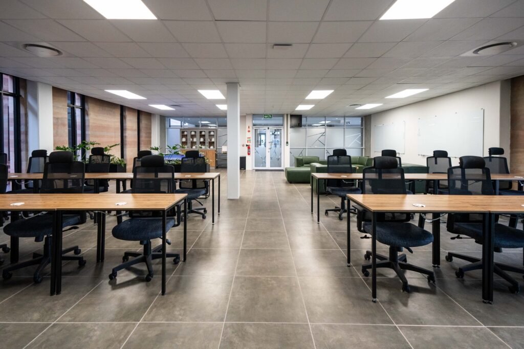 Training room tables with mesh back chairs at Oil Spill Response, furnished by Nuwave