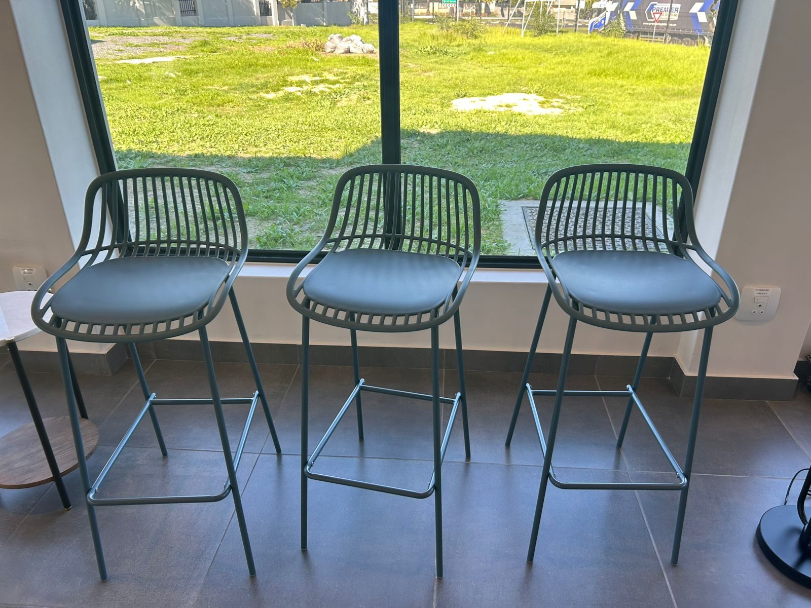 Bar stools at a window counter at Cure Day Hospital in Bellville, supplied by Nuwave