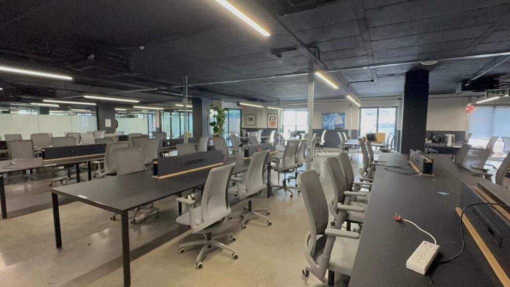 A bright run of desks and mesh back chairs at Rain in Cape Town, supplied by Nuwave