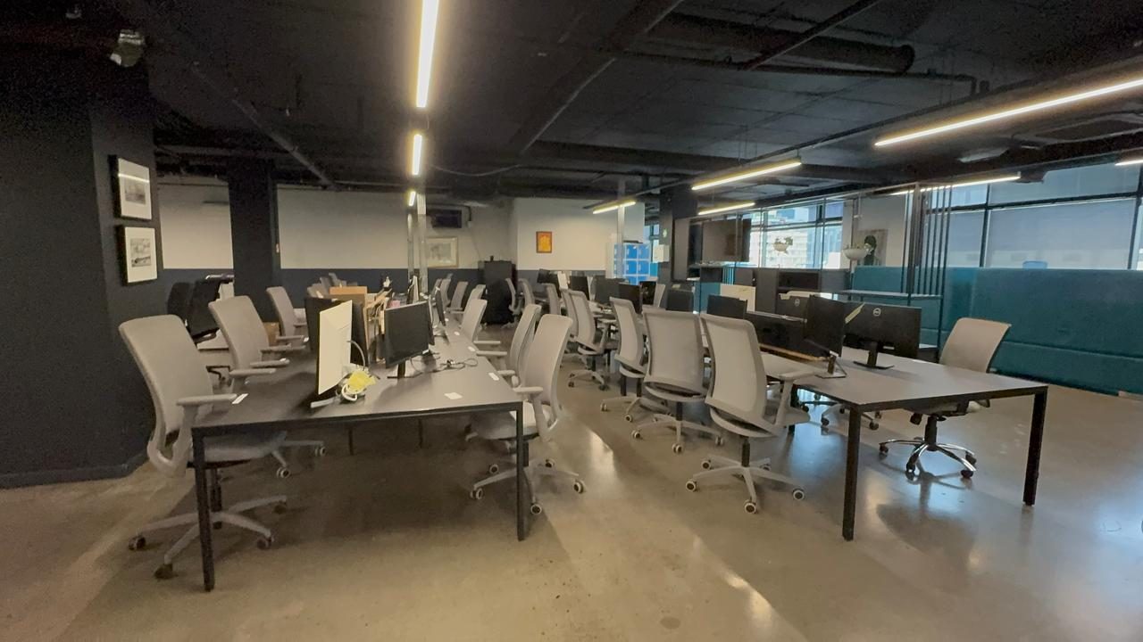 Clustered workstations and task chairs on Rain's open plan floor in Cape Town, by Nuwave