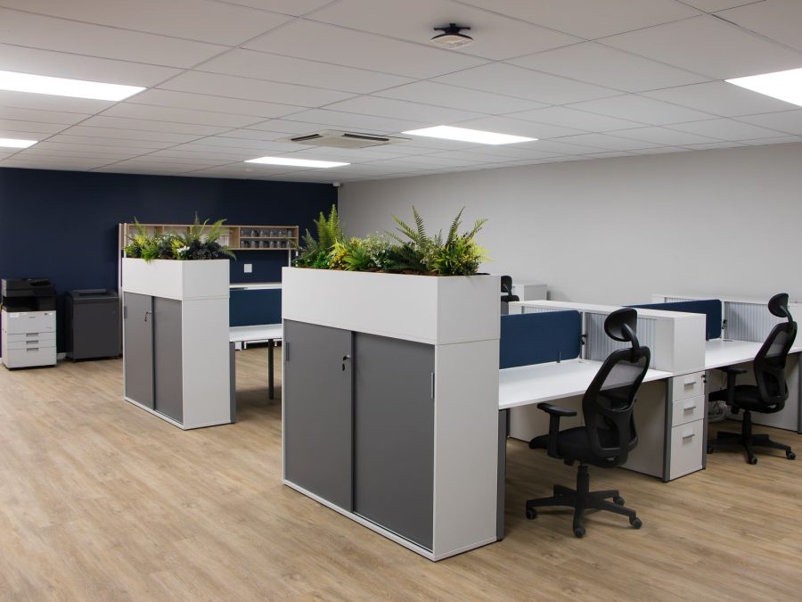 Office storage cabinets with planters in an open plan office