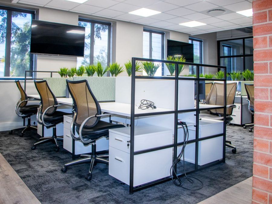 Task and ergonomic seating at white bench workstations